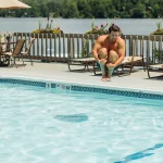 gentleman jumping into High Peaks Resort - Lake Placid pool