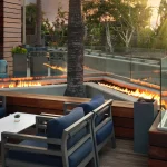 outdoor patio with fireplace at Hotel Fera Anaheim, a DoubleTree by Hilton