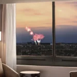 hotel room with fireworks in window