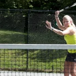 woman playing tennis at Topnotch Resort Stowe