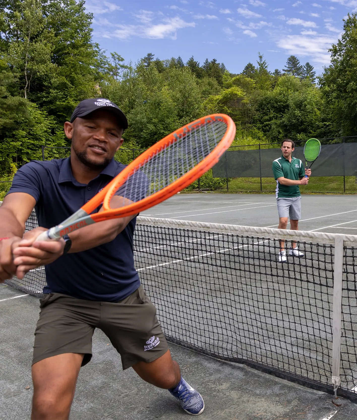 two gentleman playing tennis
