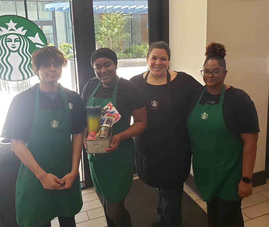 Nashville team smiling for portrait at starbucks