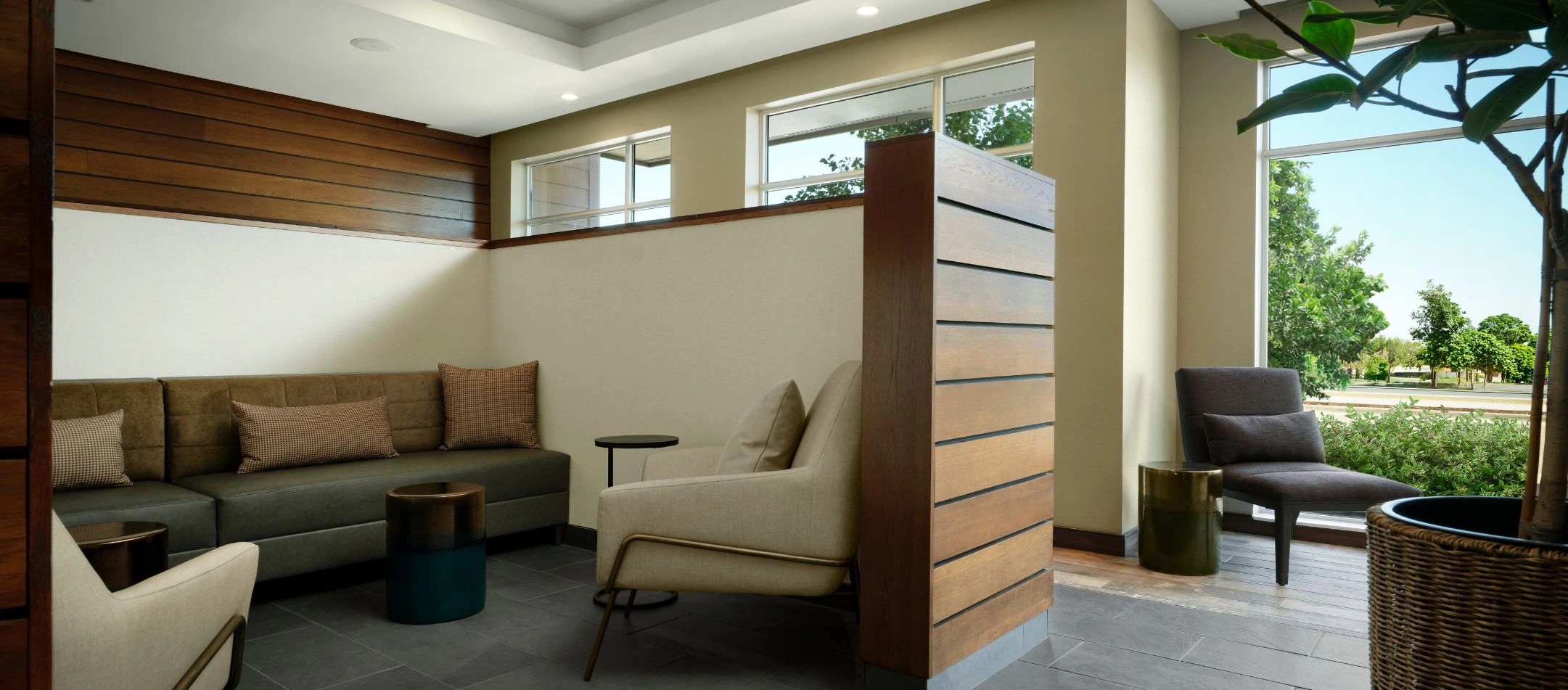 a lobby seating nook with a leather sofa at a Broomfield, CO hotel