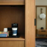 a coffee maker with cups and tea packets at a Broomfield, CO hotel