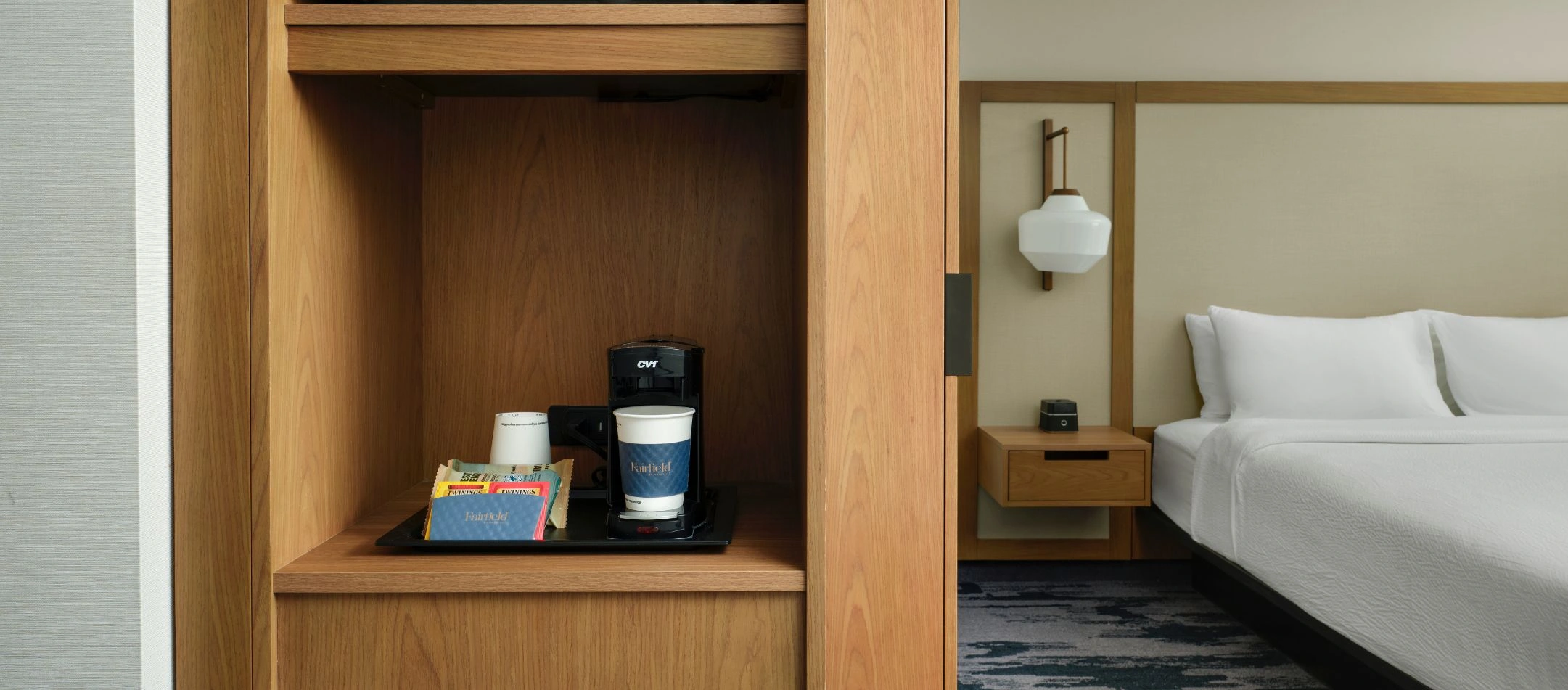 a coffee maker with cups and tea packets at a Broomfield, CO hotel