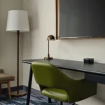 A desk and wall-mounted TV at a Broomfield, CO hotel