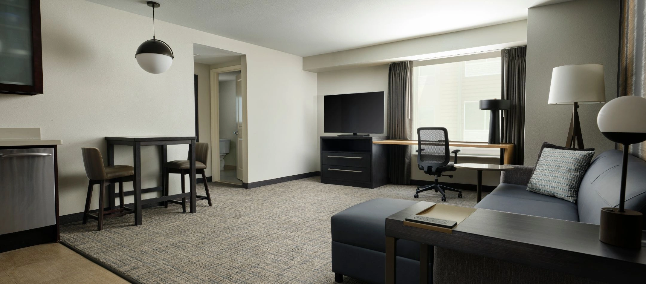 A suite living area at a Broomfield, CO hotel