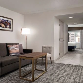 the seating area in hotel room at hilton detroit downtown