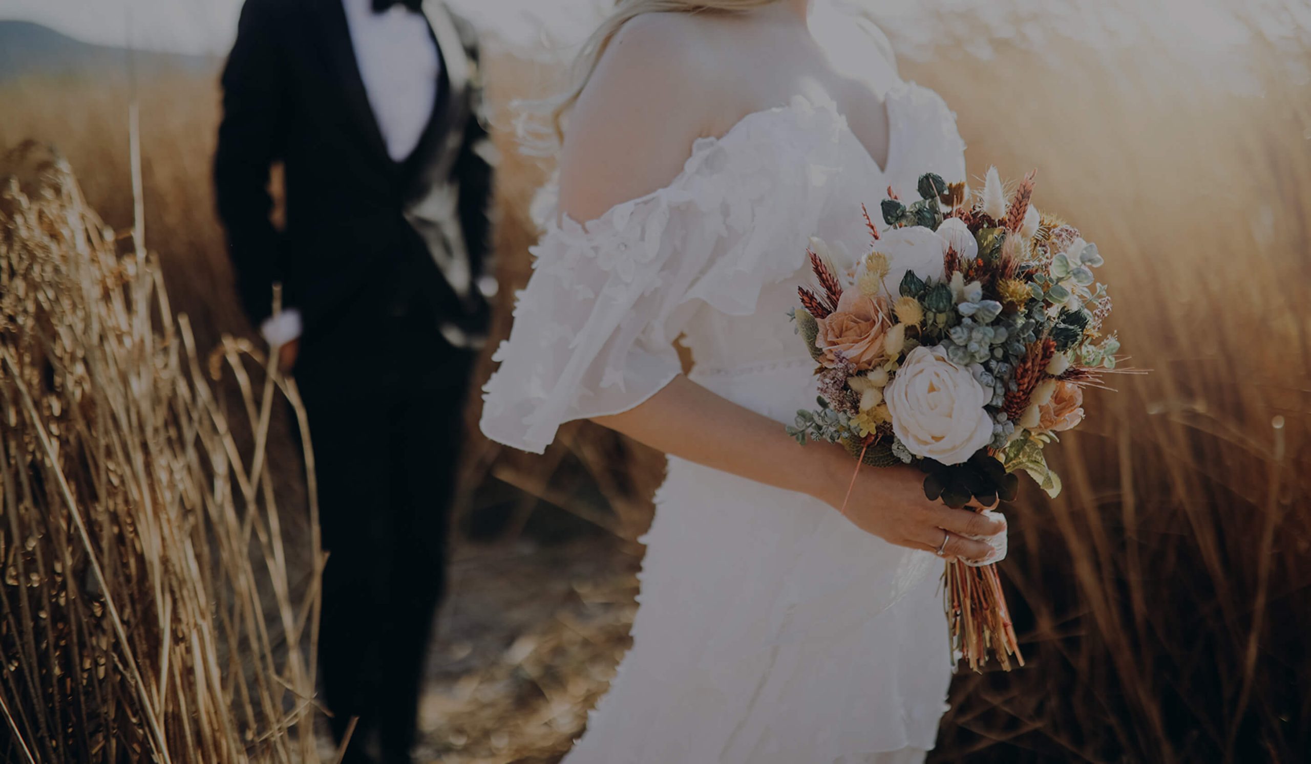 couple walking in wedding attire