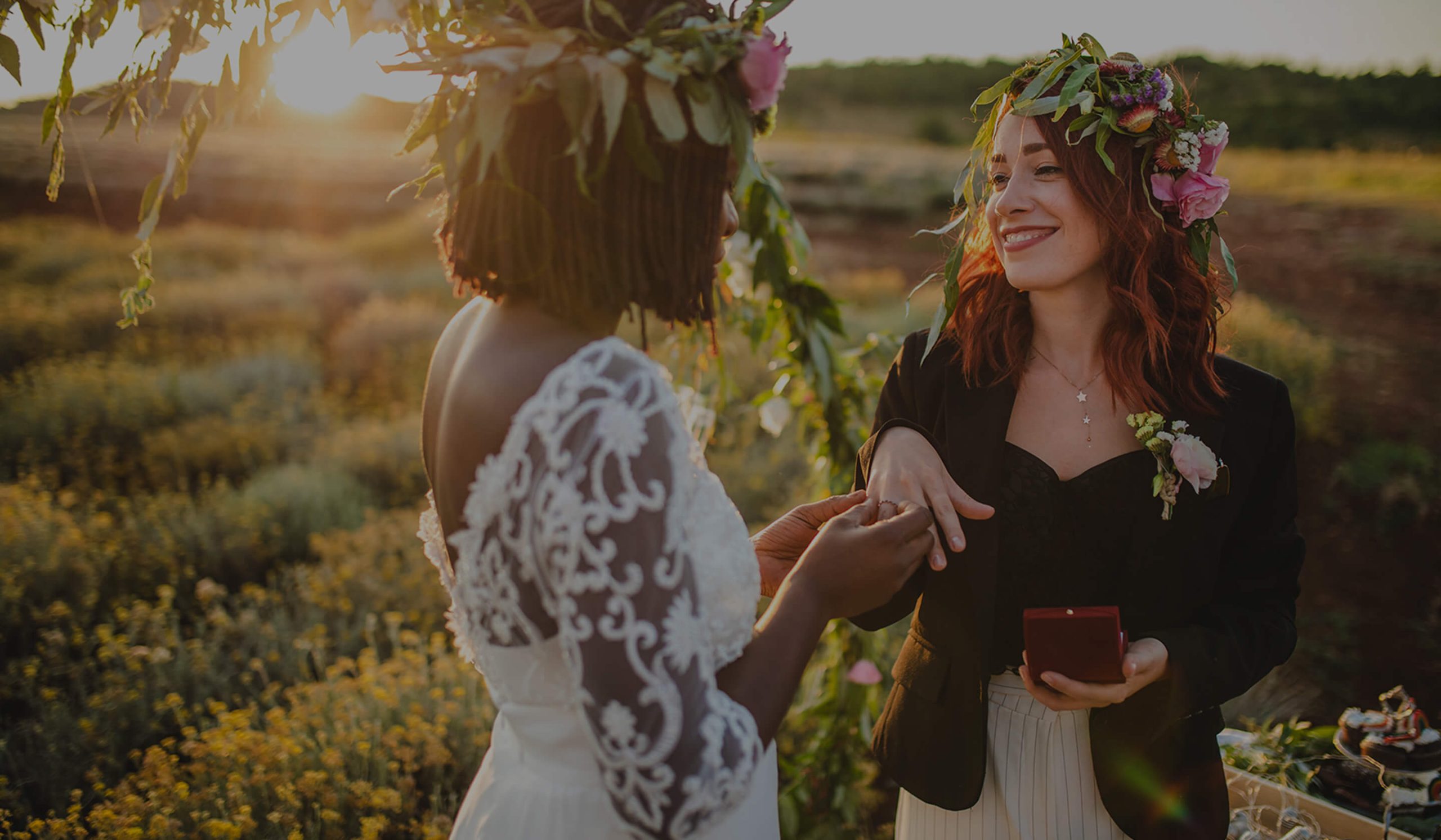 brides pose for a photo on their wedding day