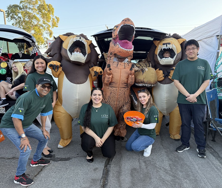 Team members from Hotel Fera Anaheim smiling for portrait at trunk or treat