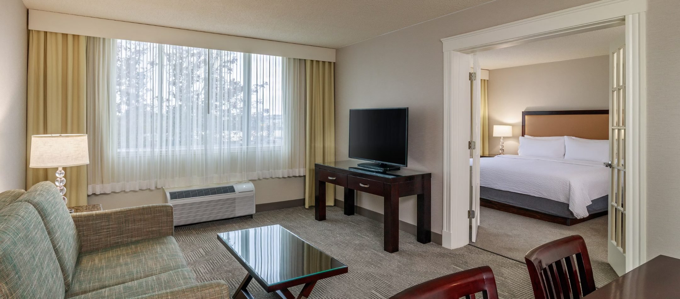 A guest room at Holiday Inn & Suites Boston-Peabody